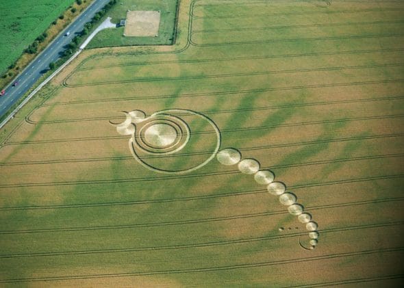 Mr. Sparkles today (Satan the great horned one) their are 14 circles including his two eyes because he lives in darkness eyes are not necessary. So we subtract to get 12 add the three average sized angels by the tail for the passages Isaiah 14:12-15